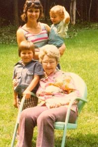 With Grandma Johanna, brother and mom in Grandma's backyard.